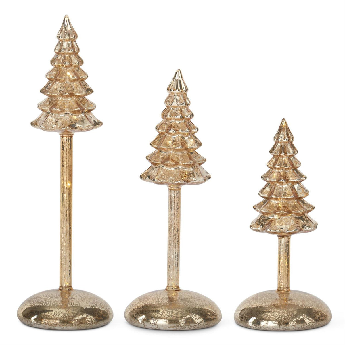 Three decorative Christmas tree figurines on stands with a white background