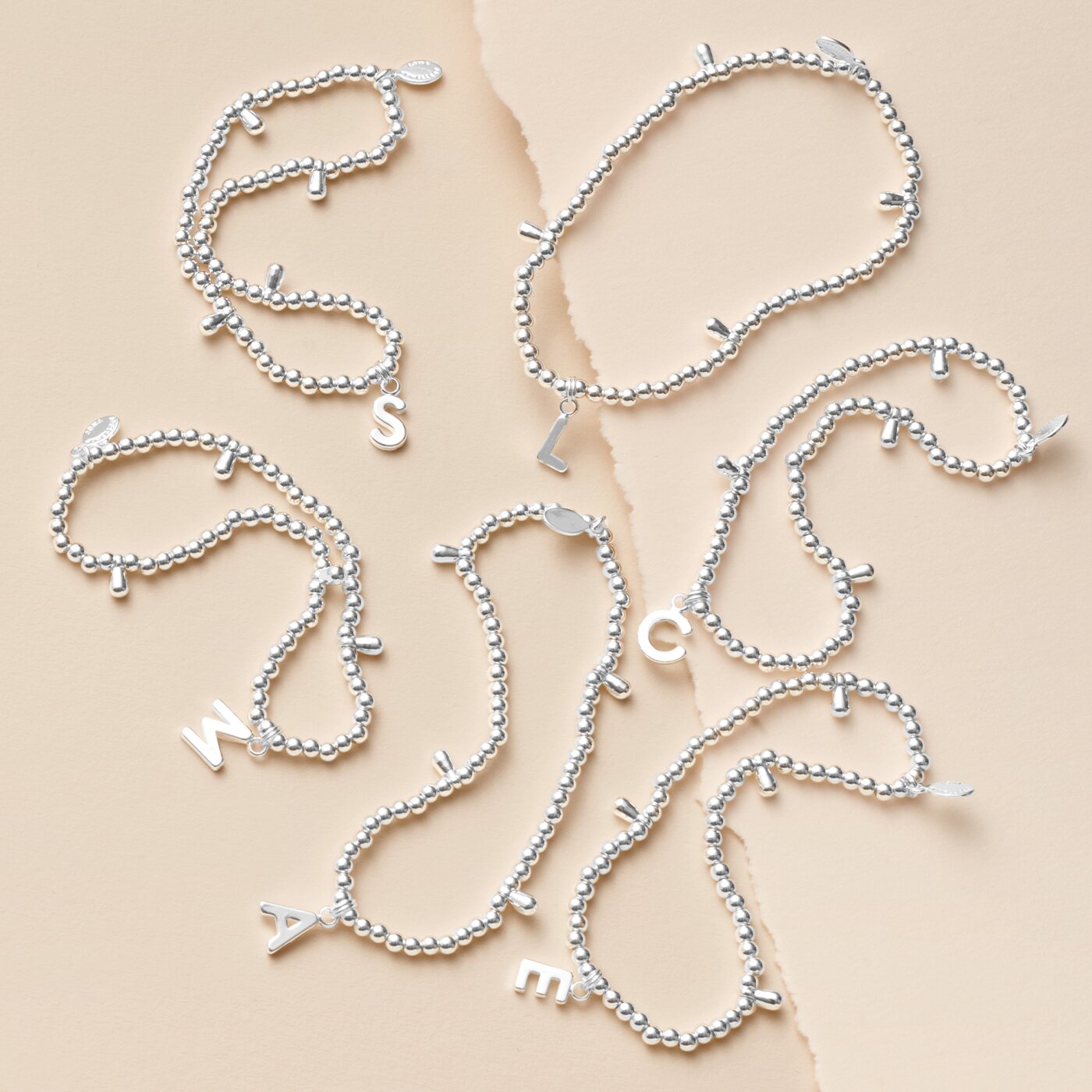A Little Alphabet Bracelet in Silver Plating